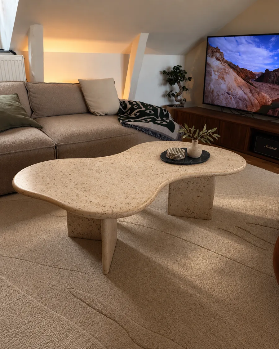 The same table from the side, on two stone legs, with a vase and a tray on top